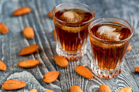Italian amaretto liqueur with dry almondsの写真素材