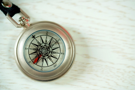Vintage compass on wooden backgroundの写真素材