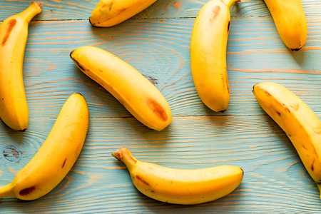 Bunch of bananas on wooden background