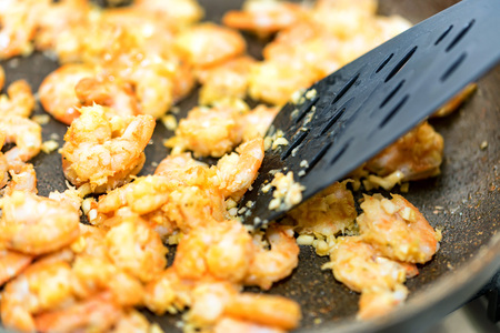 Close up of prawns fried in a frying pan with garlic butter. Traditional Thai cuisine. Seafood cookingの写真素材