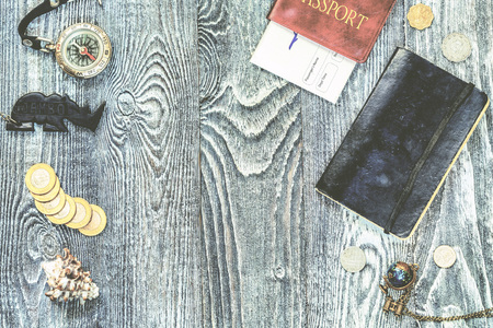 Travel accessories and symbols on wooden background. Ready to travel. Wanderlust concept