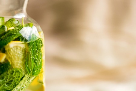 Lemonade or mojito cocktail with lemon and mint