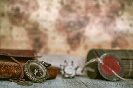 Retro compass and vintage map on the background