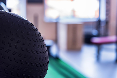 Close-up photo of black exercise ball in gymの写真素材