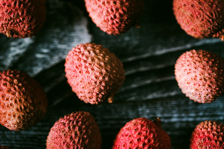 Top view lychee fruit on wooden backgroundの写真素材