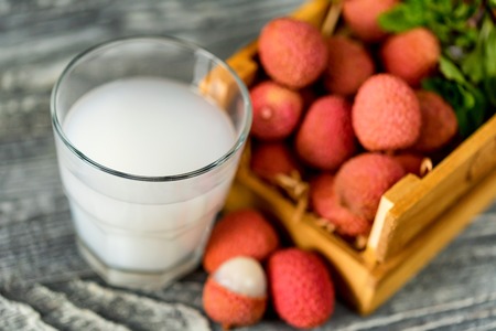 Closeup of fresh lychee juice with fruitsの写真素材