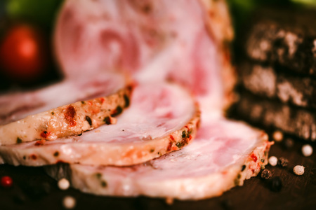 Sliced turkey roll, peppercorn and vegetablesの写真素材