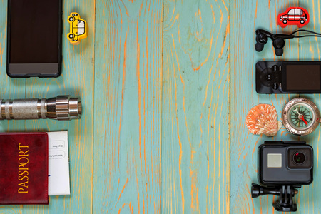 Travel accessories for trip on wooden backgroundの写真素材