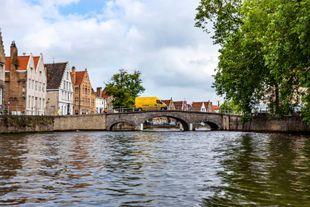 BRUGES, BELGIUM - JUNE 10, 2014: Beautiful view of canal in Bruges, Belgiumのeditorial素材