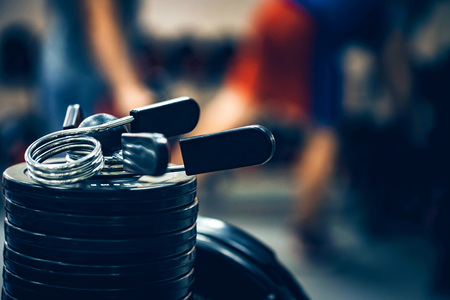 Fitness expander and barbell weight platesの写真素材