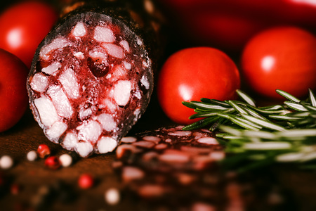 Tasty salami with tomatoes and peppercorn closeの写真素材