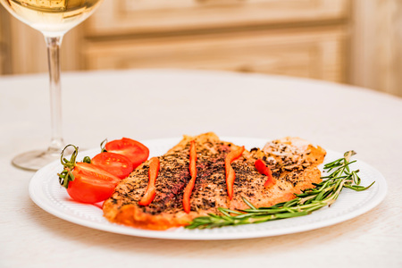 Roasted fish fillet with vegetables for dinnerの写真素材