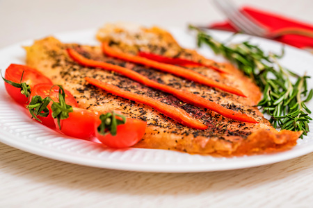 Roasted fish fillet with vegetables closeの写真素材