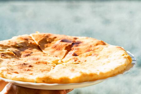 Caucasian khychin bread pie with cheese closeの写真素材