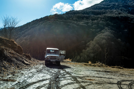 DOMBAY, RUSSIA - FEBRUARY 10, 2018: Offroad car parked in Russian mountainsのeditorial素材