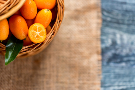 Kumquat or cumquat on wooden tableの写真素材