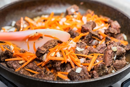 Beef stew with vegetables in frying panの写真素材