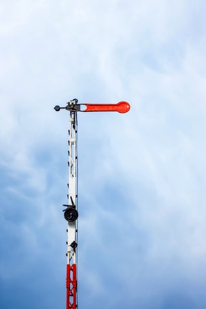 Old railway semaphore against skyの写真素材