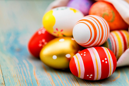 Several colorful Easter eggs in sack close