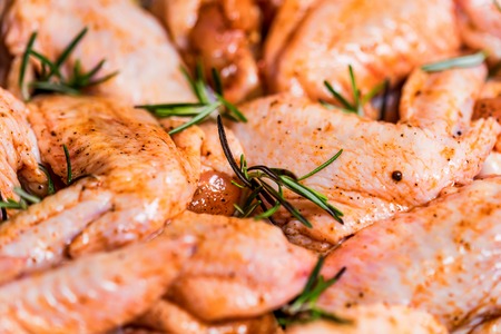 Fresh chickens wings covered in honey and spicesの写真素材