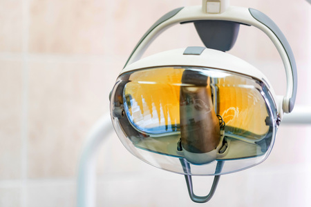Dental light in dentist office. Dental clinic equipment - close up image of medical exam light.の写真素材