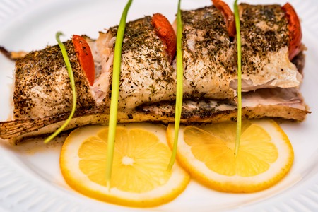 Roasted zander fillet with asparagus and lemonの写真素材