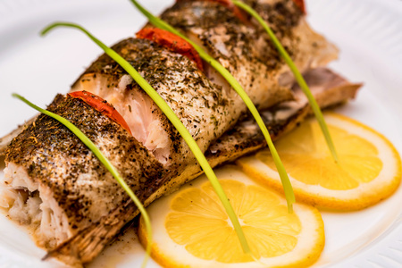 Roasted zander fillet with asparagus and lemonの写真素材