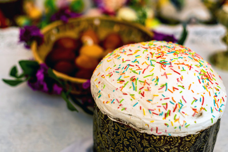 Easter cake and painted eggs in the basket