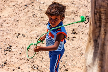 DAHAB, EGYPT - AUGUST 26, 2010: Young unidentified Bedouin boy in Egyptのeditorial素材