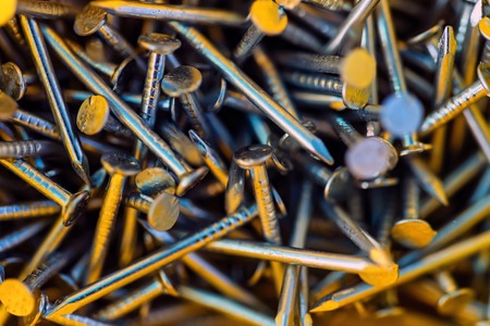 Background of metal nuts bolts and nailsの写真素材
