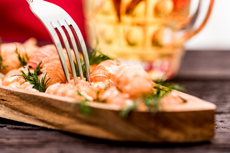 Boiled crayfish with beer on wooden backgroundの写真素材