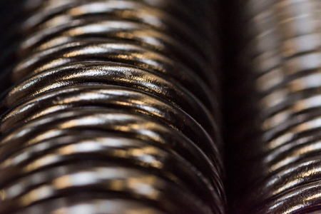 Closeup of shiny galvanized coiled helical springsの写真素材