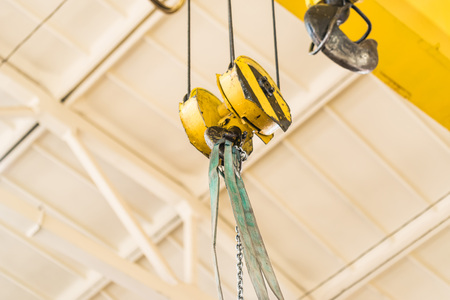 Industrial yellow crane hookの写真素材