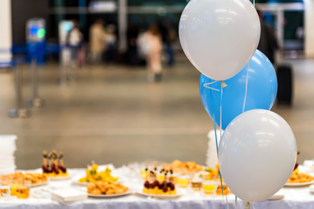 Blue and white baloons at reception hall