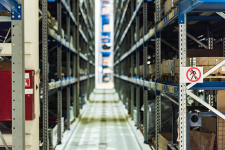Blurred interior of modern spare parts warehouse