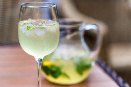 Refreshing Mojito cocktail in glass and jug closeの写真素材