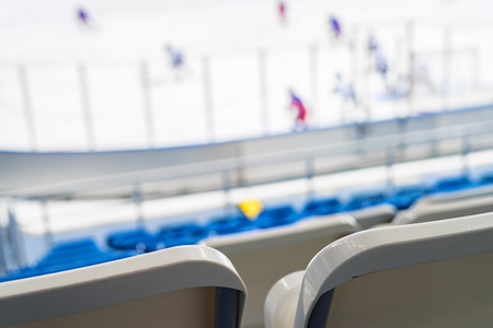 Empty blue seats at hockey rinkの写真素材