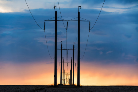 Rural landscape with power poles at sunriseの写真素材