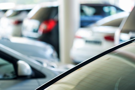 Interior of car dealer showroom with new carsの写真素材