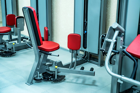 New fitness machines in modern gym interior
