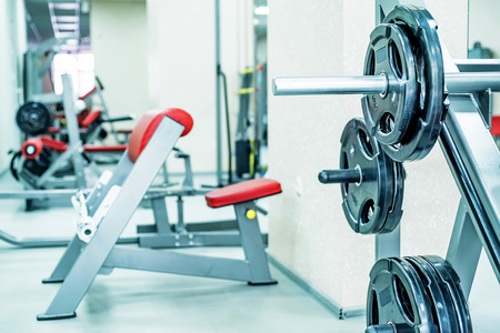 New fitness machines in modern gym interiorの写真素材