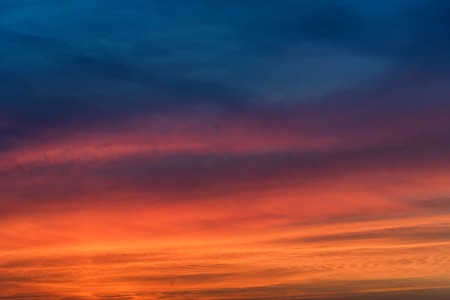 Dramatic sunset sky with blue and red cloudsの写真素材