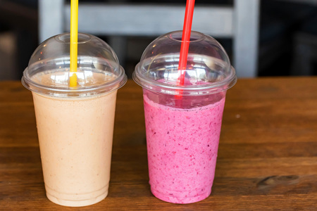 Two glasses with fresh smoothie on table