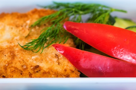 Plastic bowl with sliced food for airplane meal closeの写真素材