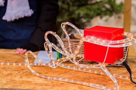 Gift box on Santas sleigh firure close upの写真素材