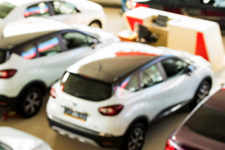 New cars at dealer showroom blurred interiorの写真素材
