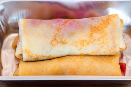 Sweet pancakes with stuffing served as airplane foodの写真素材