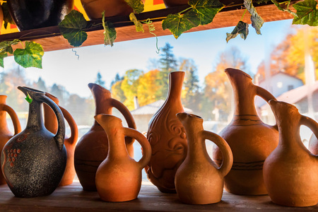 Several beautiful handmade earthenware jugs for saleの写真素材