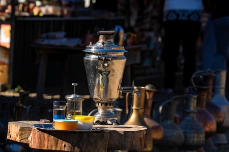 Traditional Russian samovar and tea accessories outdoorsの写真素材