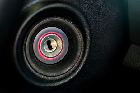 Close up shot of the ignition keyhole in a carの写真素材